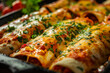Mexican-style enchiladas with meat and chili red sauce close up.