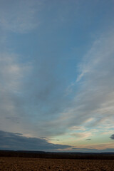 Wall Mural - Summer sunset over wheat field. Beautiful sunset sky over countryside