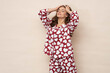 © forma82 - Well-slept and relaxed brunette in heart-print pajamas.
