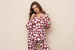 © forma82 - Well-slept and relaxed brunette in heart-print pajamas.