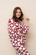 © forma82 - Well-slept and relaxed brunette in heart-print pajamas.