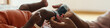 Web banner of mother putting socks on feet of little baby