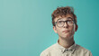 The studio portrait of nerd boy with curious face isolated on light color background with Copy space for text.