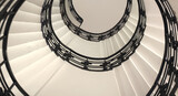 Fototapeta Perspektywa 3d - Spiral staircase still life with black ornament railing top view