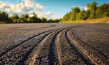 Fototapeta Kuchnia - Tire Tracks On The Asphalt Road Background