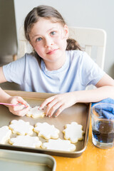 Wall Mural - Little Girl Spells 'Sorry' on Iced Sugar Cookies