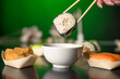 Japanese cuisine - Maki sushi roll with minced reindeer meat, cream cheese, grated horseradish, cucumber, white pepper, seaweed