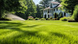 Automatic sprinkler system evenly waters the lush green lawn, ensuring it stays healthy and vibrant under the warm sun, a convenient solution for garden maintenance.