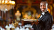 © Kondor83 - African-American server showing dish in restaurant, indoors