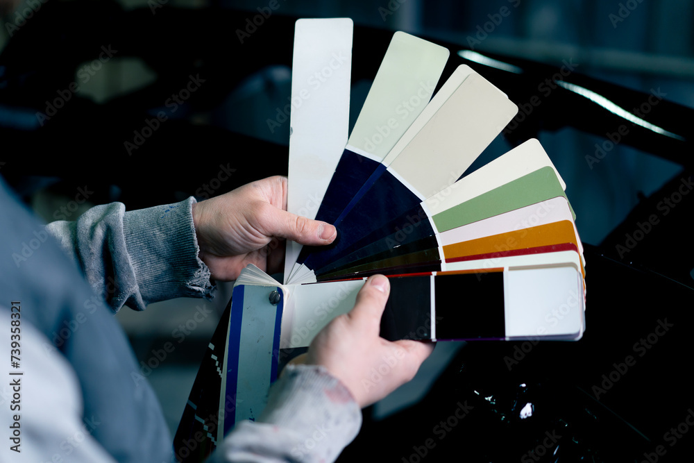 Maintenance Color Work close-up of hand at a service station a master master selects paint ...