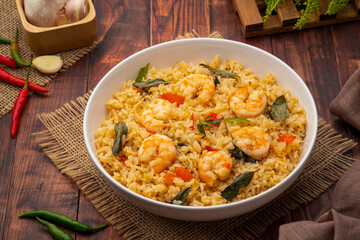 Wall Mural - Spicy Shrimp Fried Rice with thai holy basil leaves in white plate