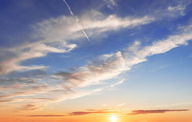 Wall Mural - Beautiful sunset sky above clouds with dramatic light. Sunset Sky, Beautiful nature.