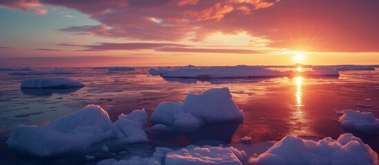 Wall Mural - majestic sunset view of ocean with glowing icebergs in arctic waters