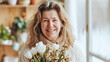 © ximich_natali - A middle-aged woman beaming with happiness, holds a bright bouquet of flowers. Festive spring holidays, mother's day, March 8, teacher's day