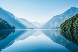 Fototapeta Do pokoju - Tranquil lake mirroring a serene mountain landscape untouched by time