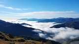 Fototapeta  - Mountains with sea fog below,misty mountain top and cloud bed view,