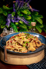 Poster - Fried noodles with chicken and vegetables.