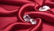 © Antonio Giordano - Shiny rubies diamonds brilliants gemstones on red fabric wavy background. Luxury Diamonds crystals and silk satin fabric texture background.
