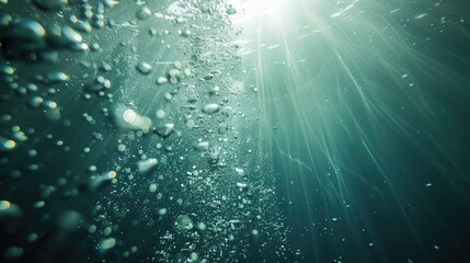 Wall Mural - Sunlight underwater with bubbles rising to water surface in the sea