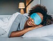 © SandraSevJarocka - black woman calmly sleeping with sleep mask. the importance of sleep for a healthy lifestyle