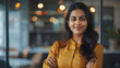 © Annemarie - Positive beautiful young indian business woman posing in office with hands folded, looking at camera with toothy smile. Happy female entrepreneur, professional, worker girl head shot portrait