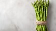 Fresh green asparagus on a light surface