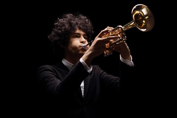 Poster - Young man in a black suit playing a trumpet