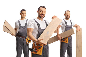 Wall Mural - Team of carpenters holding wooden floor beams