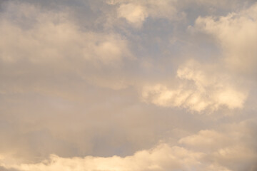 Wall Mural - Dramatic stormy sky in evening light as the sun is setting, as a nature background
