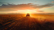© saichon - As the sun sets over the horizon, a tractor tirelessly works the dry fields, leaving behind a dramatic dust cloud. AI Generated