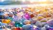 close up of Colorful gemstones on a beach background