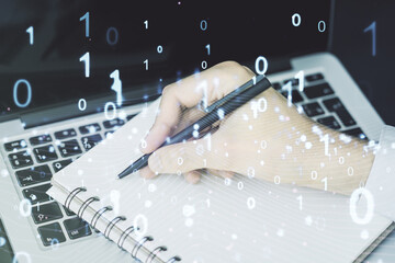 Leinwandbilder - Creative concept of binary code illustration and hand writing in notebook on background with laptop. Big data and coding concept. Multiexposure