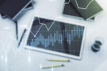 Poster - Multi exposure of abstract financial graph and modern digital tablet on desktop on background, top view, financial and trading concept