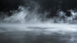 © wanchai - An enigmatic image of swirling fog covering a dark, reflective surface, conveys a sense of mystery and depth.