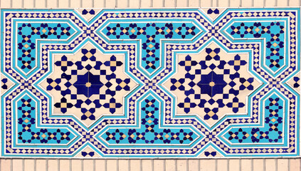 Wall Mural - Detail of traditional persian mosaic wall with geometric ornament of blue, dark blue and yellow color, Iran