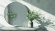 a round mirror on the dressing table with calls and delicate greenery in a calm soft interior