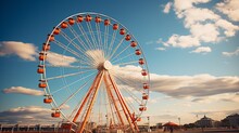 The Majestic Ferris Wheel Rides Against The Backdrop Of A Clear Sky