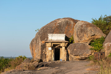 Wall Mural - Ancient Rock-Cut Cave Temple in Shravanabelagola Captured During a Bright Daytime