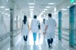© เลิศลักษณ์ ทิพชัย - A blurry photo shows Doctors and nurses running the hospital while engineers collaborate on designing and installing advanced medical equipment