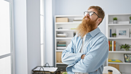 Sticker - Confident redhead man smiling, arms crossed, feeling the success, standing relaxed in elegant office interior