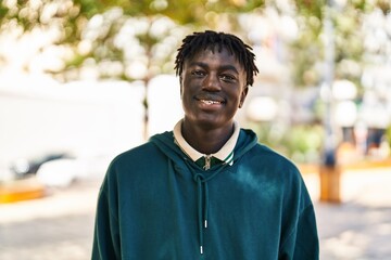 Wall Mural - African american man smiling confident standing at park