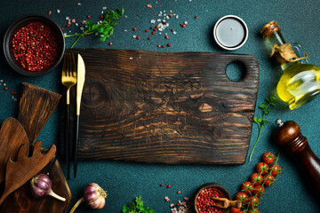 Wall Mural - Food background. Spices, herbs and kitchen tools. Top view. free space for your text. Rustic style.