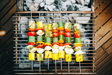 Poster - overhead shot of vegetable skewers cooking on a grill