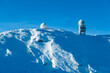 Panoramic view of austro control Goldhaube on snow covered mountain peak Grosser Speikogel in Kor Alps, Lavanttal Alps, Carinthia Styria, Austria. Winter wonderland in Austrian Alps. Ski touring