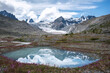 mountains glacier lake reflection clouds flowers