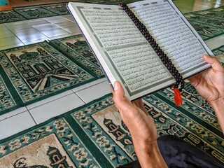 young men read the Koran in the mosque in the holy month of Ramadan