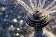closeup of sprinkler head with water jets