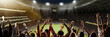 © master1305 - Back view of emotional football fans cheering favorite soccer team at crowded open air stadium at evening time during game. Concept of competition, leisure time, emotions, live sport event