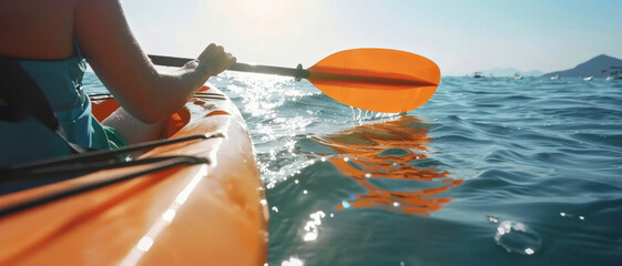 Wall Mural - Person kayaking in the sea at sunset, symbolizing adventure, exploration, and the beauty of nature