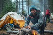 A rugged man in outdoor clothing tends to the crackling campfire, surrounded by the serenity of nature, as he prepares for a cozy night under the stars with his trusty tent and hiking equipment nearb